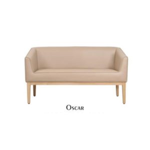Modern beige leather "Oscar" sofa by Flexi Seating Systems with a sleek, minimalist design and light wooden legs, ideal for contemporary hotel lobbies and guest rooms in New Town, West Bengal. Hotel furniture manufacturer for bulk/single orders.