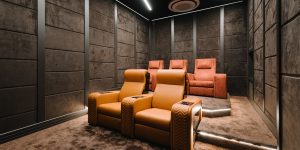 Luxurious auditorium chairs by Flexi Seating System in a modern home theater setup